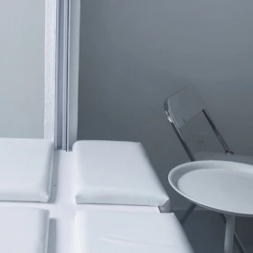 Minimalist clinical setup showing a sleek treatment table with biomechanical tools neatly arranged.