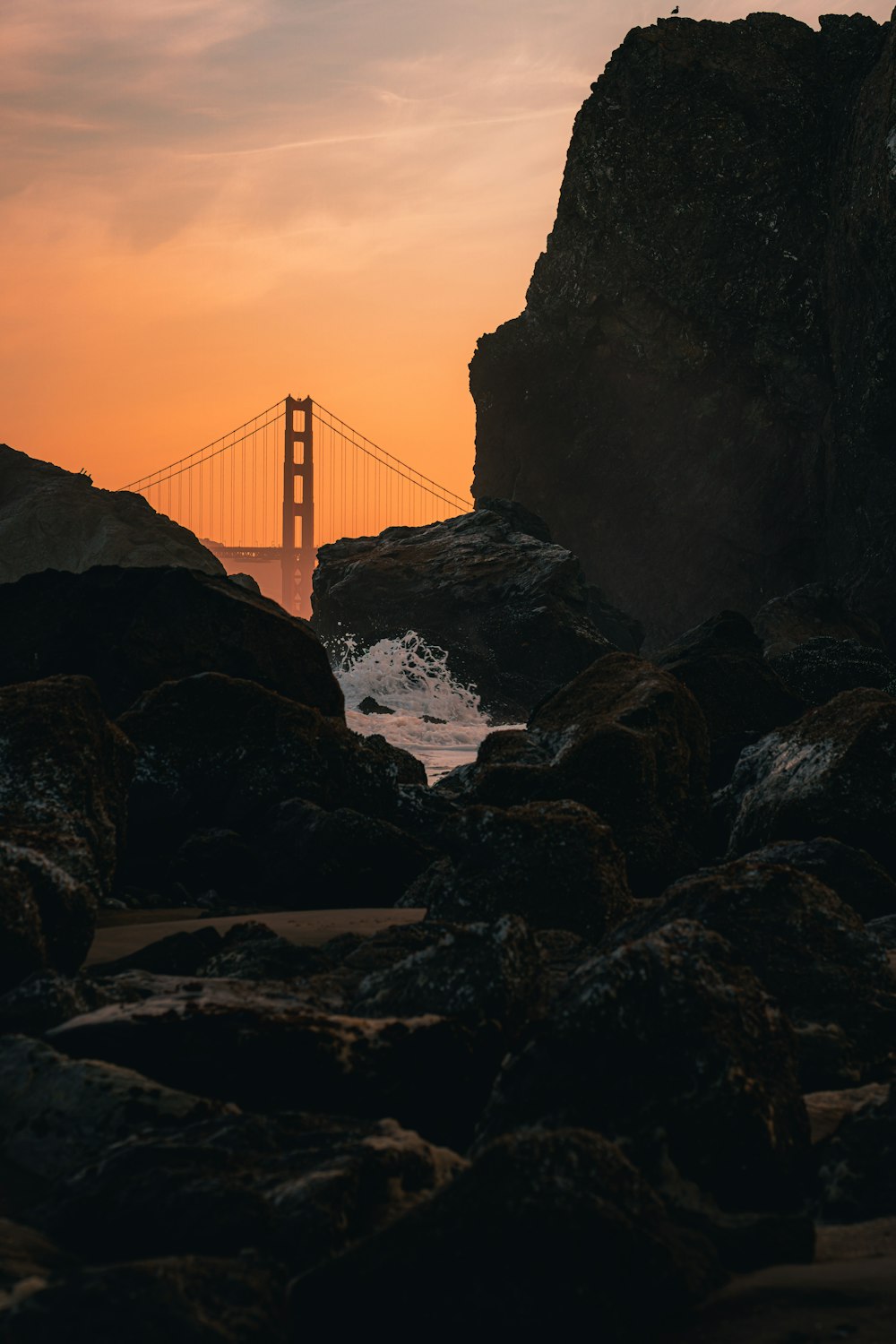 a view of the golden gate bridge at sunset