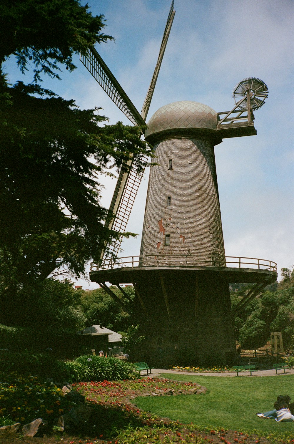 a windmill that is sitting in the grass
