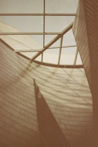 Elegant grid layout of curated property developments under soft natural light.