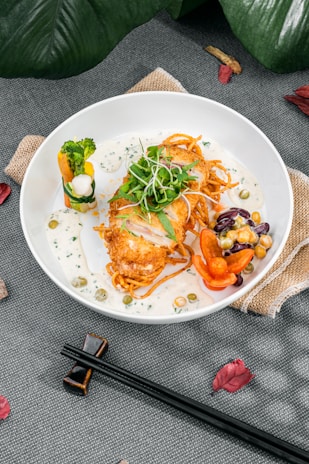A beautifully plated dish of fried chicken with sides.