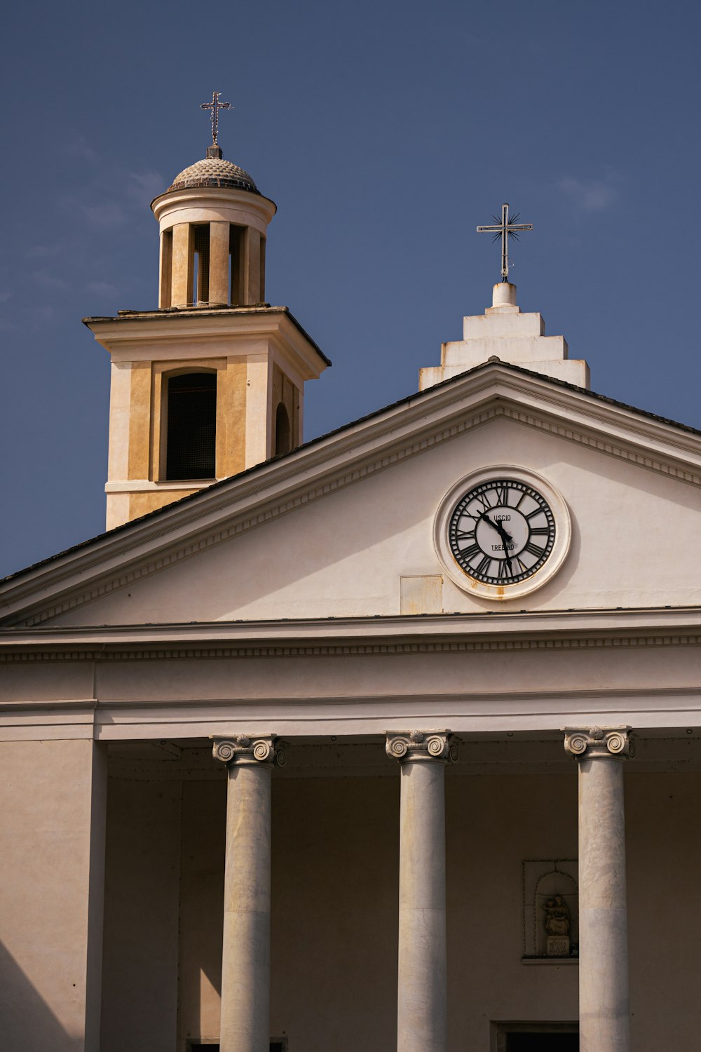 a church with a clock on the front of it