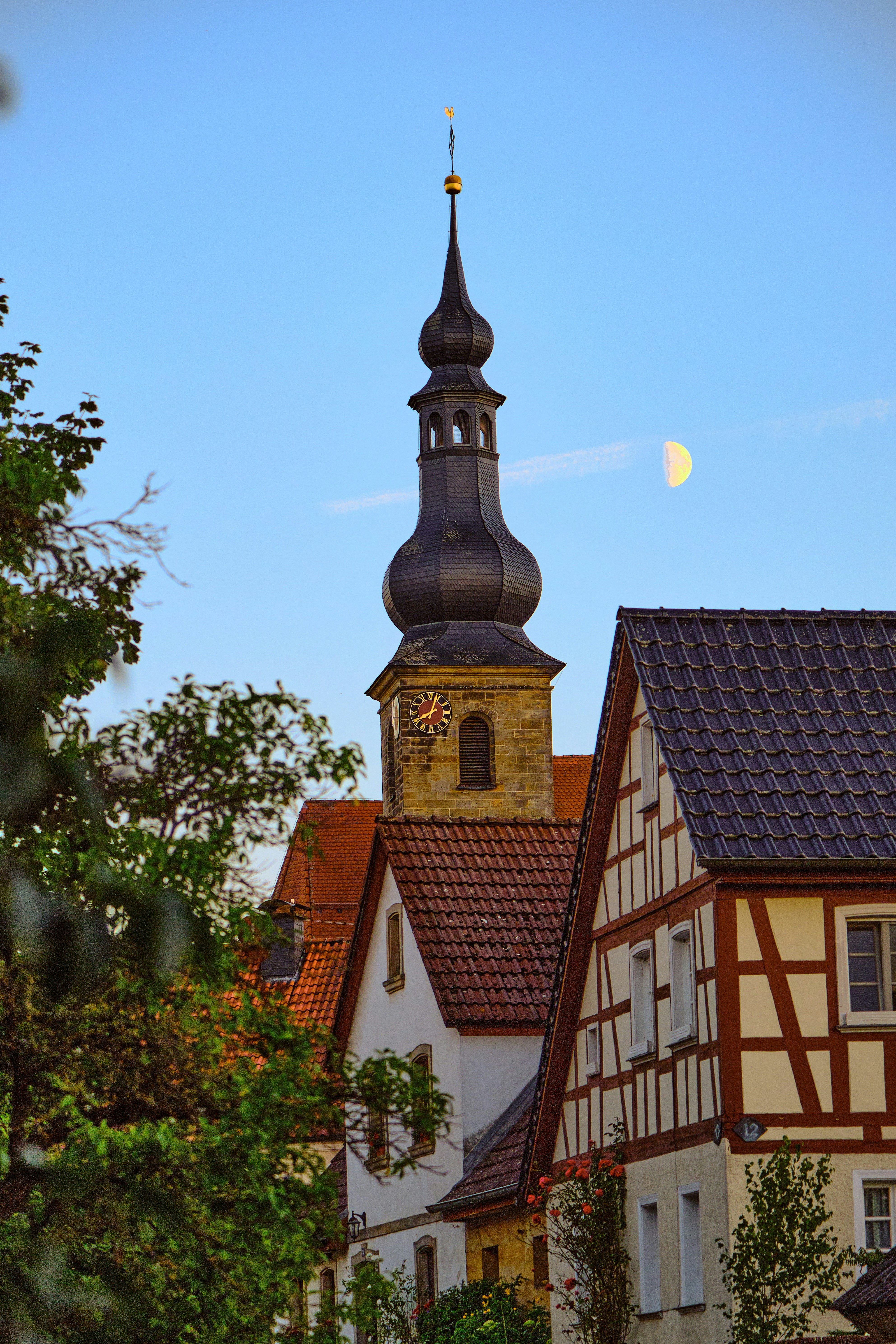 a building with a steeple and a clock tower
