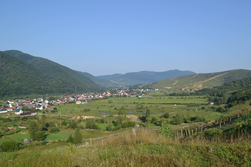 a view of a small town in the mountains