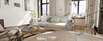 a living room filled with furniture and lots of windows