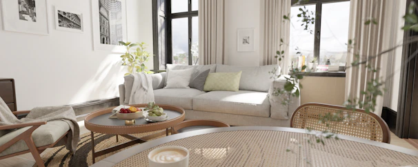 a living room filled with furniture and lots of windows
