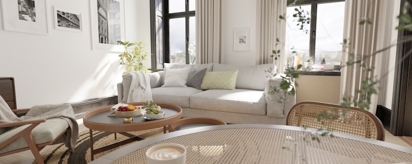a living room filled with furniture and lots of windows