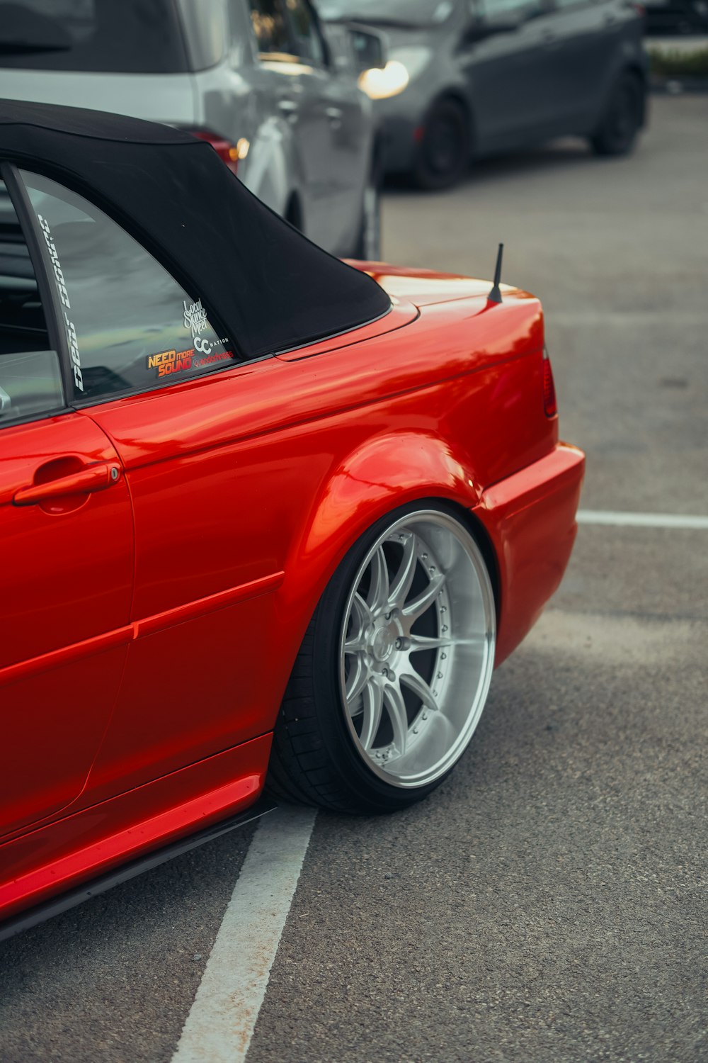 a red car parked in a parking lot