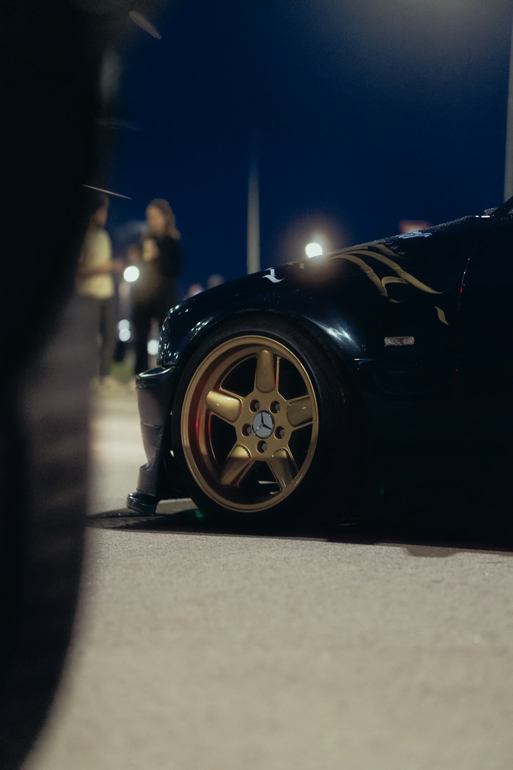 a black sports car parked on the side of the road