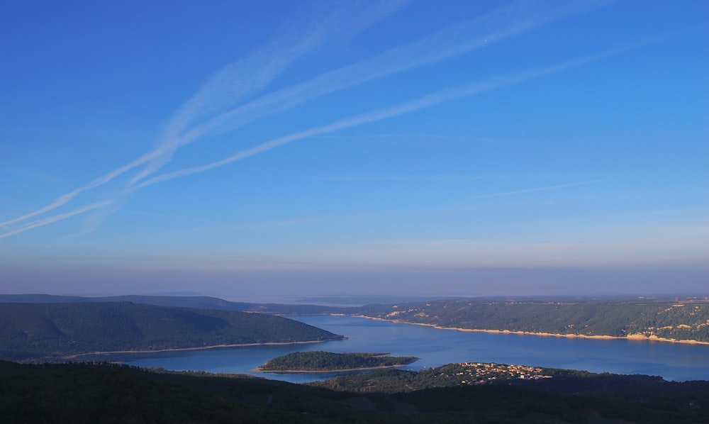 a view of a body of water from a hill