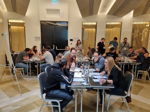 a group of people sitting around a table
