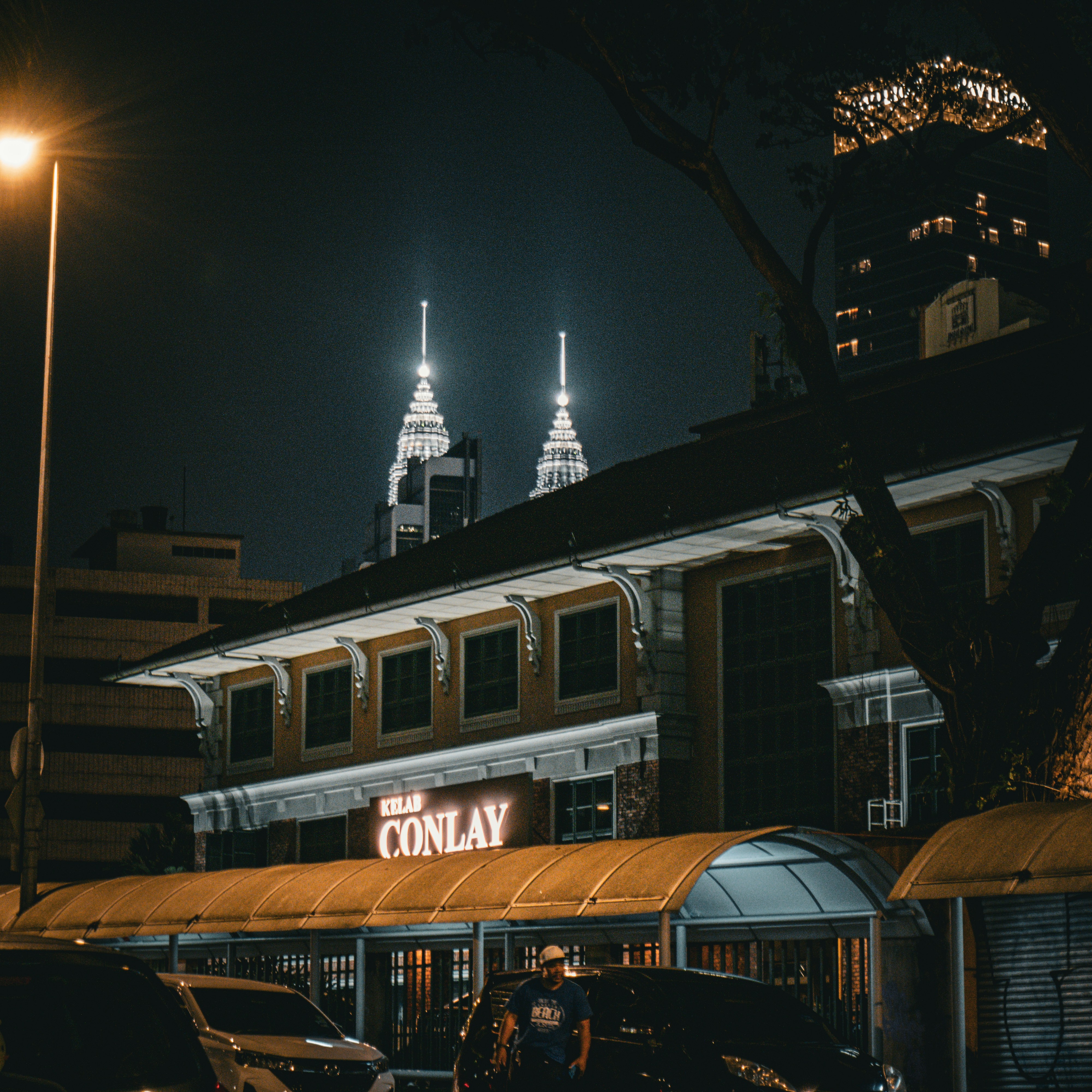 a building with a sign that says the conlay on it