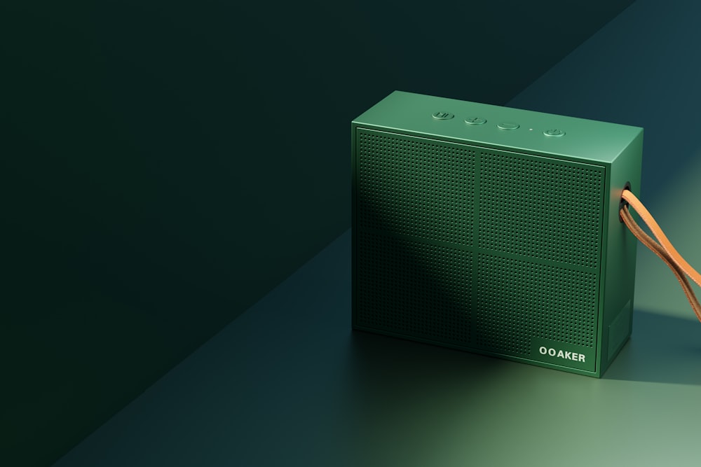 a green radio sitting on top of a table