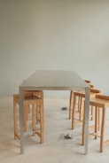 A stylish stainless steel table in a contemporary setting.