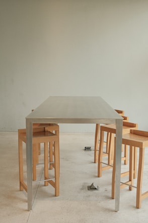 a group of stools and a table in a room
