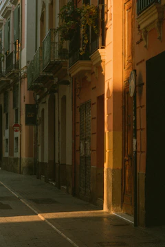 A cinematic still showing a sunlit street scene with vibrant colors.