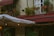 A cozy outdoor space featuring custom-made fabric awnings providing shade and style.