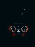 Close-up of a sleek dark-themed dashboard with neon green highlights showing performance metrics