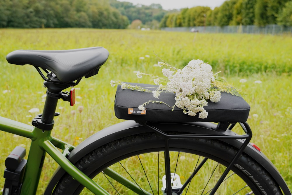 a bicycle with a flower arrangement on the seat