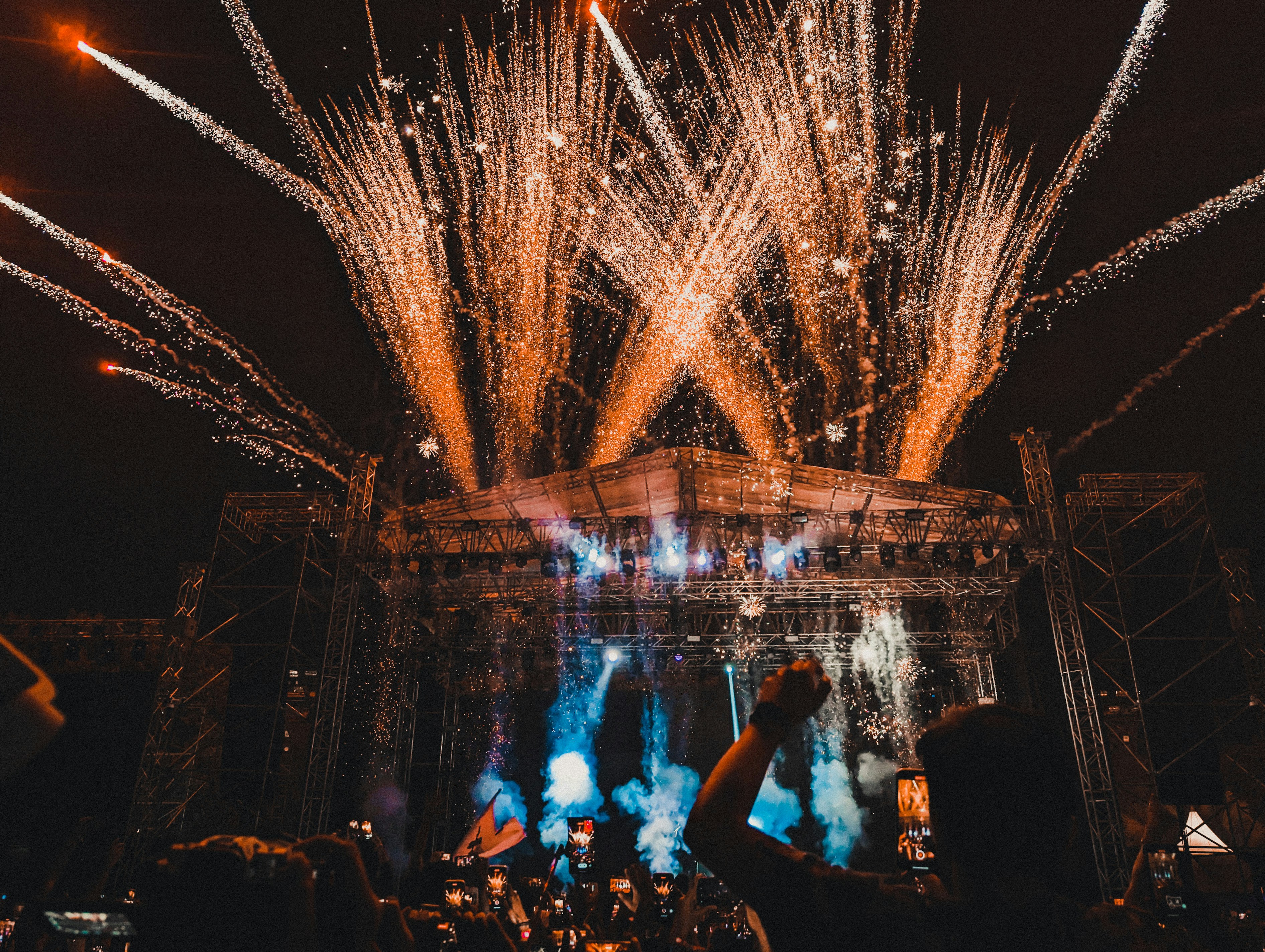 Crowd watching fireworks on stage