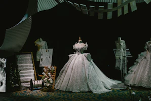 Elegant display of vibrant women's evening gowns with intricate embroidery.
