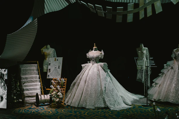 Elegant display of vibrant women's evening gowns with intricate embroidery.