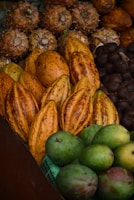 Colorful assortment of tropical fruits displayed on a rustic wooden table