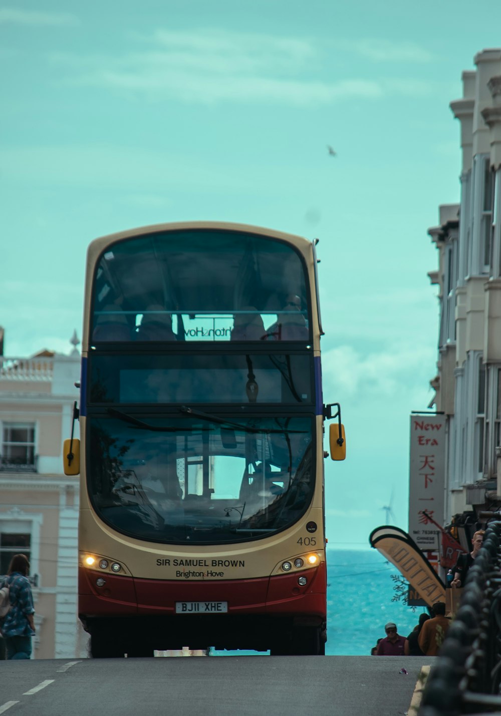 a double decker bus driving down a street