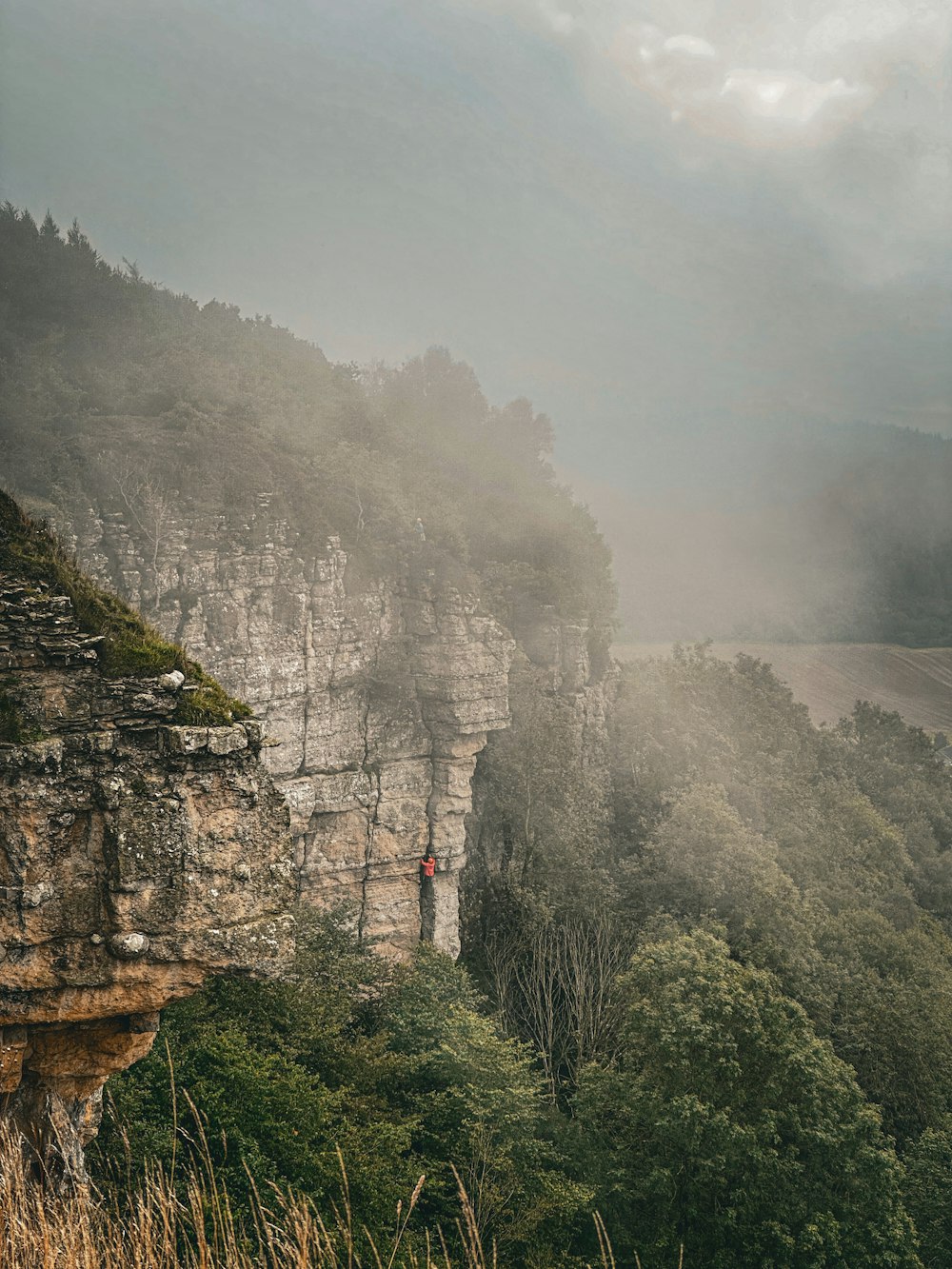 a person standing on the edge of a cliff