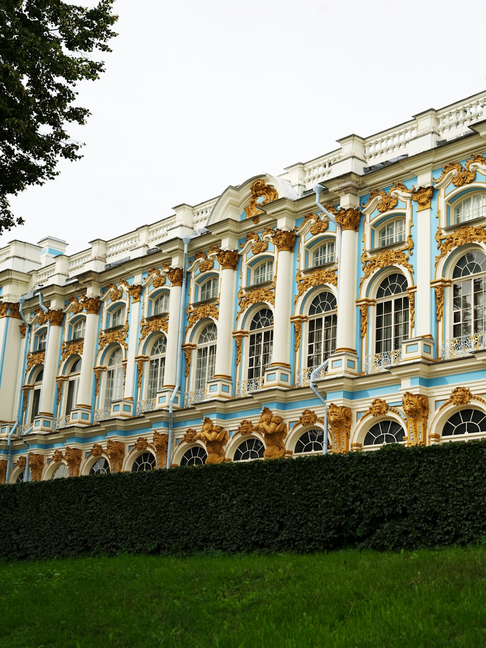 a large blue and white building with a clock on it's side