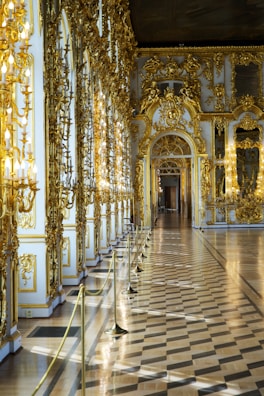 Sophisticated hallway featuring gold-trimmed details and subtle lighting.