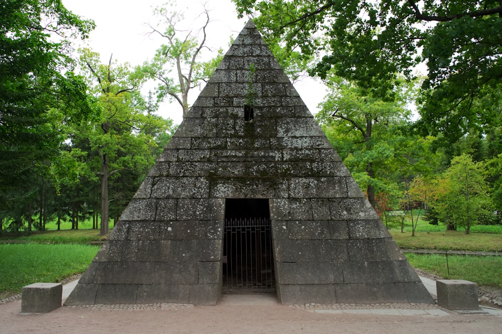 a stone structure with a gate in the middle of it