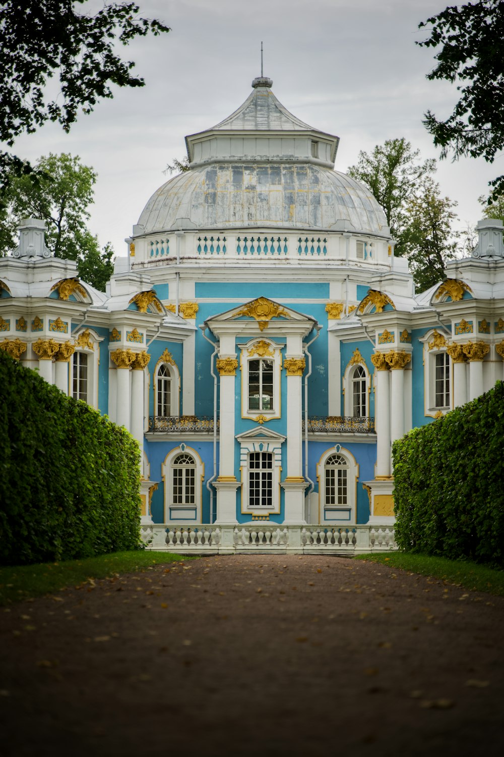 a blue and white building with a white dome