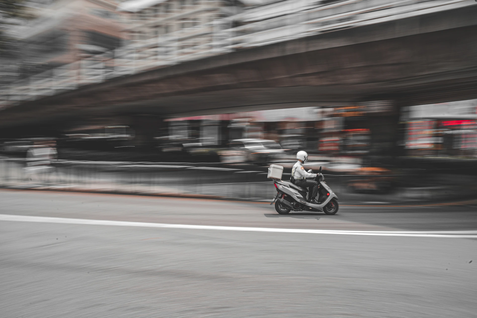 a person riding a motorcycle on a city street