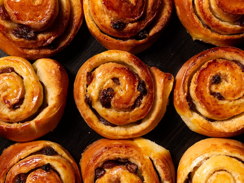 a bunch of cinnamon rolls sitting on top of a table