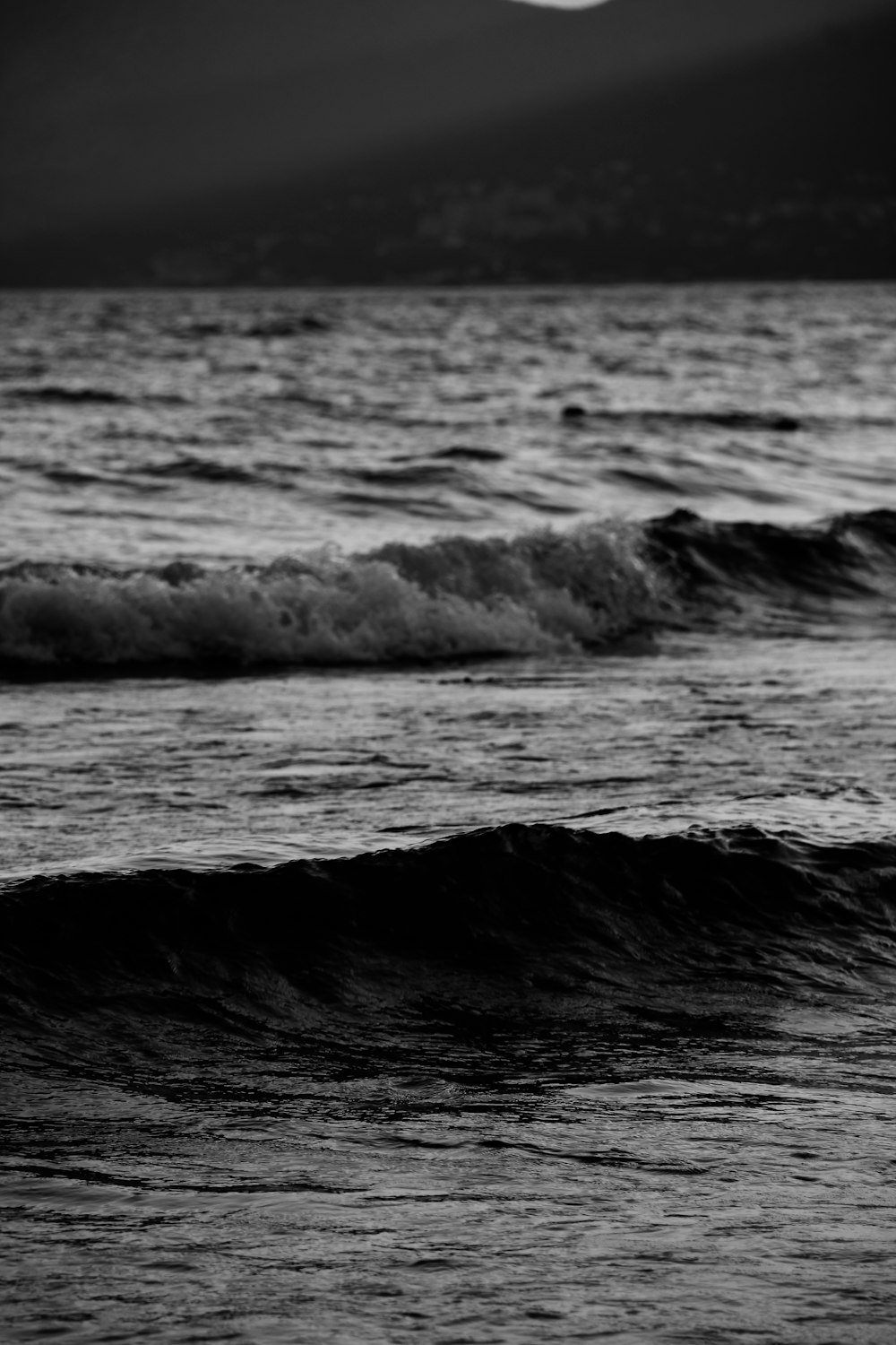 a person riding a surfboard on a wave in the ocean