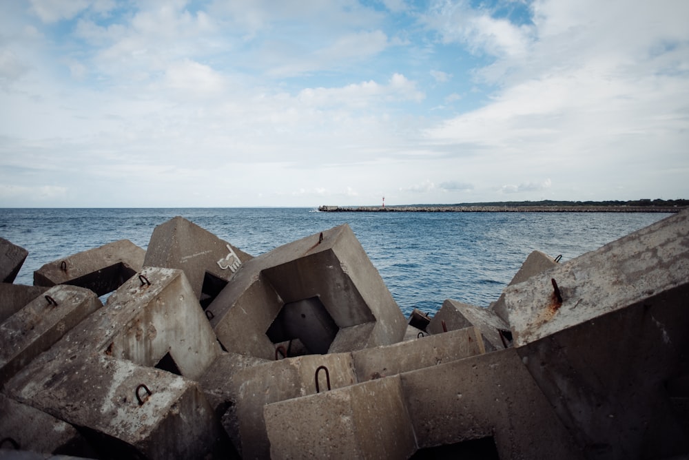 a concrete structure sitting on top of a body of water