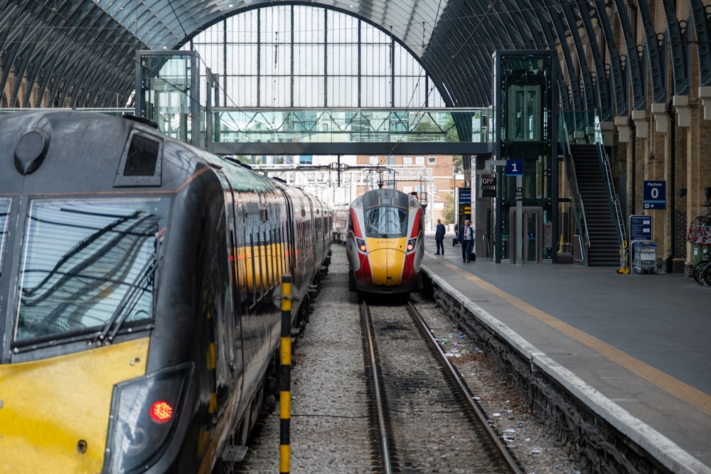 a couple of trains that are sitting on the tracks