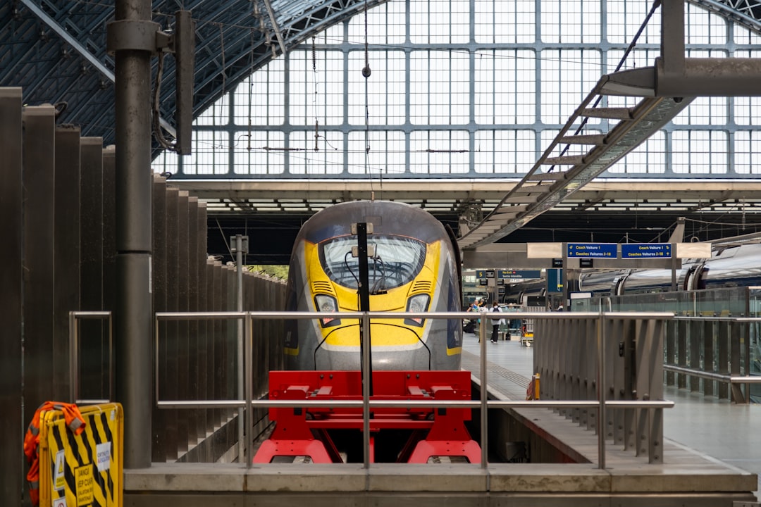a train that is sitting in a train station, A Eurostar train getting ready to leave St. Pancras station
