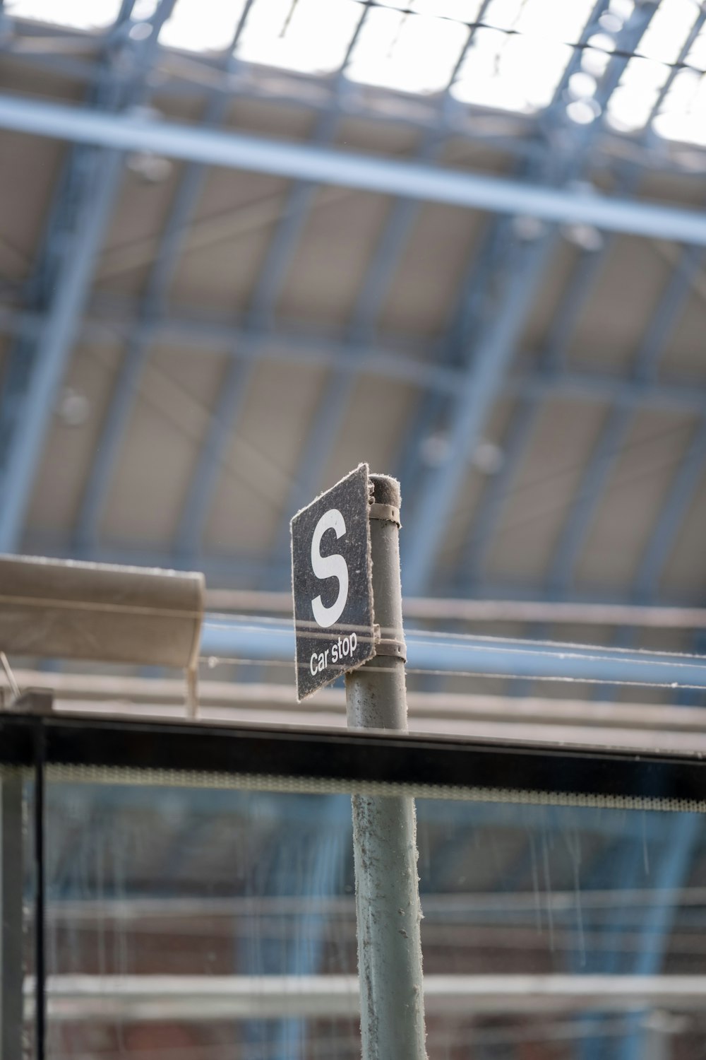 a street sign in front of a train station