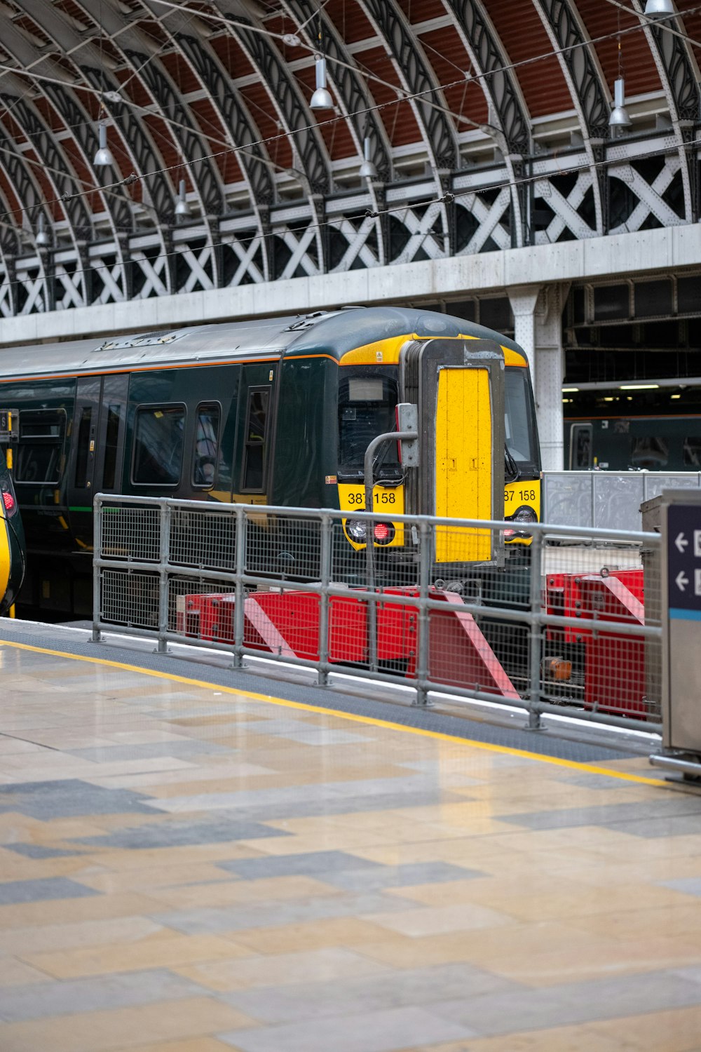 a yellow and black train at a train station