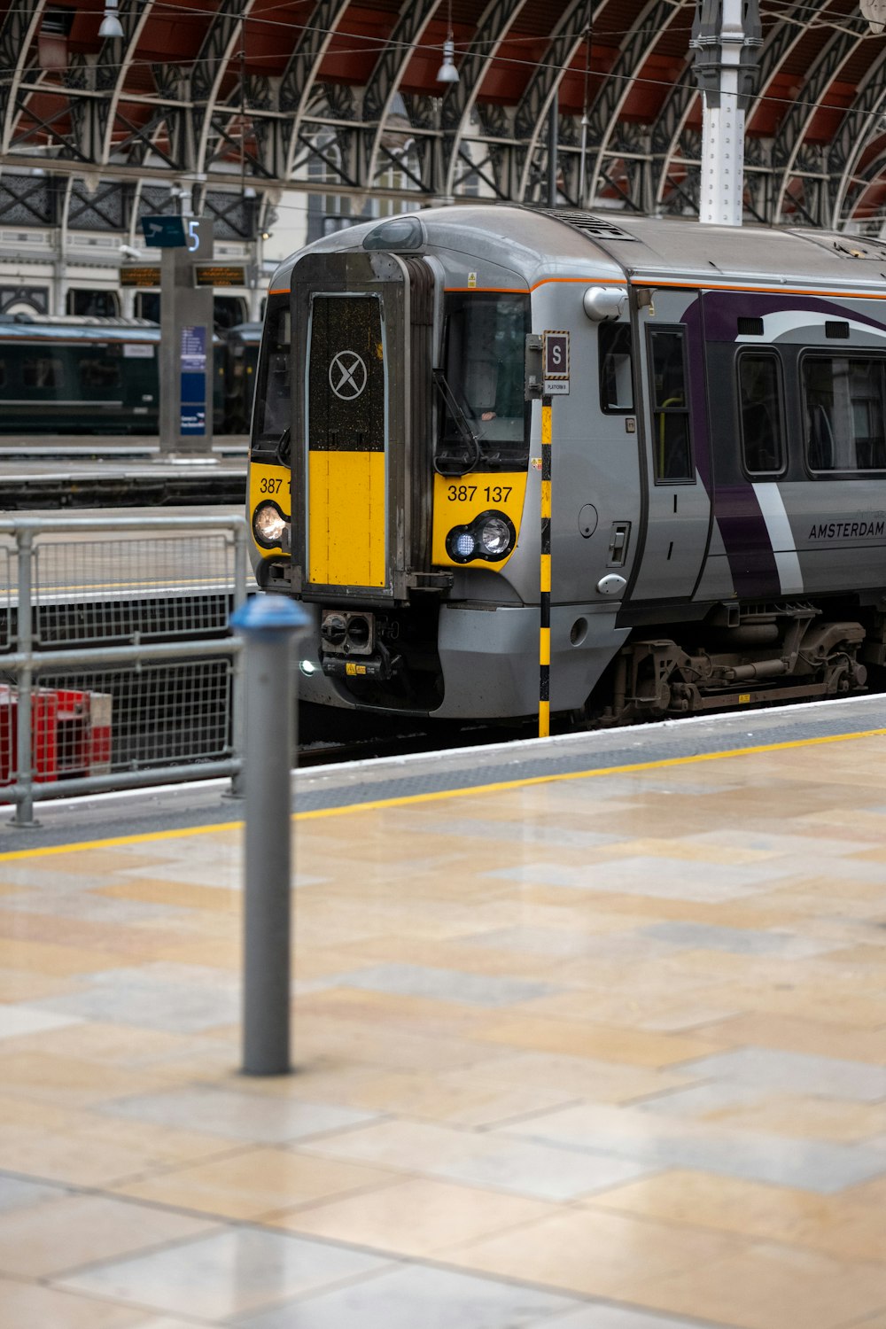 a train on a track in a train station