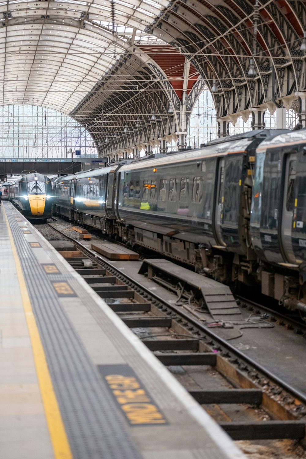 a couple of trains that are sitting in a station