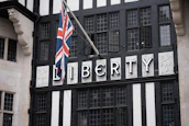 a black and white building with a flag on top of it