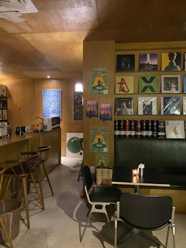Cozy karaoke and wine bar with warm lighting and inviting atmosphere.
