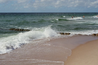 The Waves logo displayed prominently with a backdrop of people collaborating and enjoying activities.