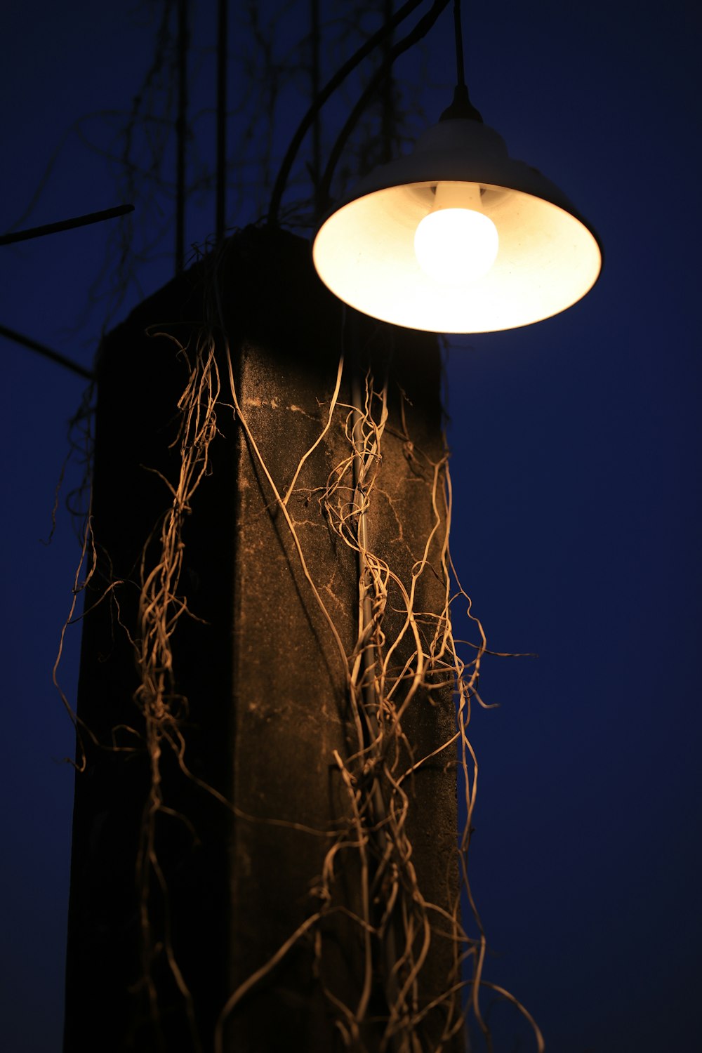 a light hanging from the side of a building