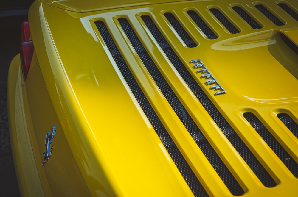 a close up of the grills on a yellow sports car