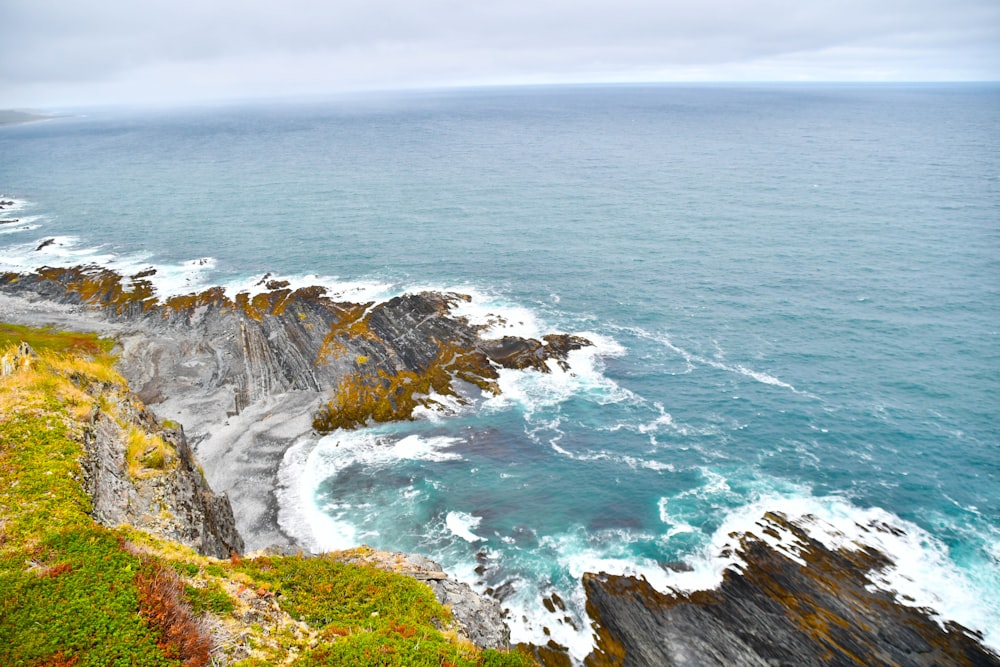 a view of the ocean from the top of a cliff