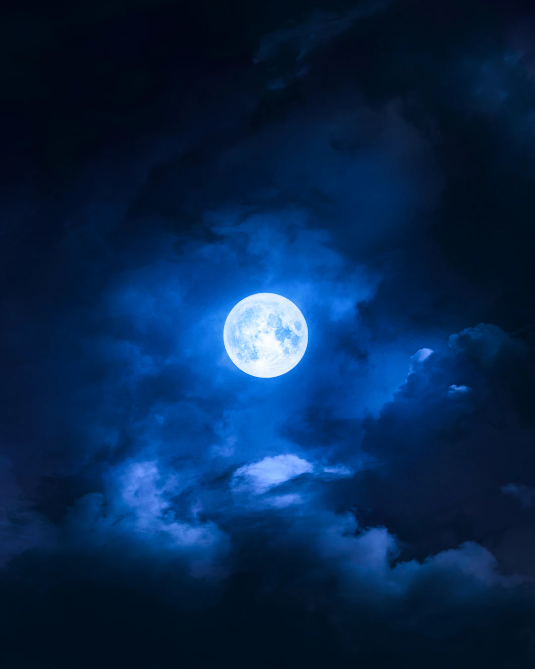 Full moon glowing in the night sky
